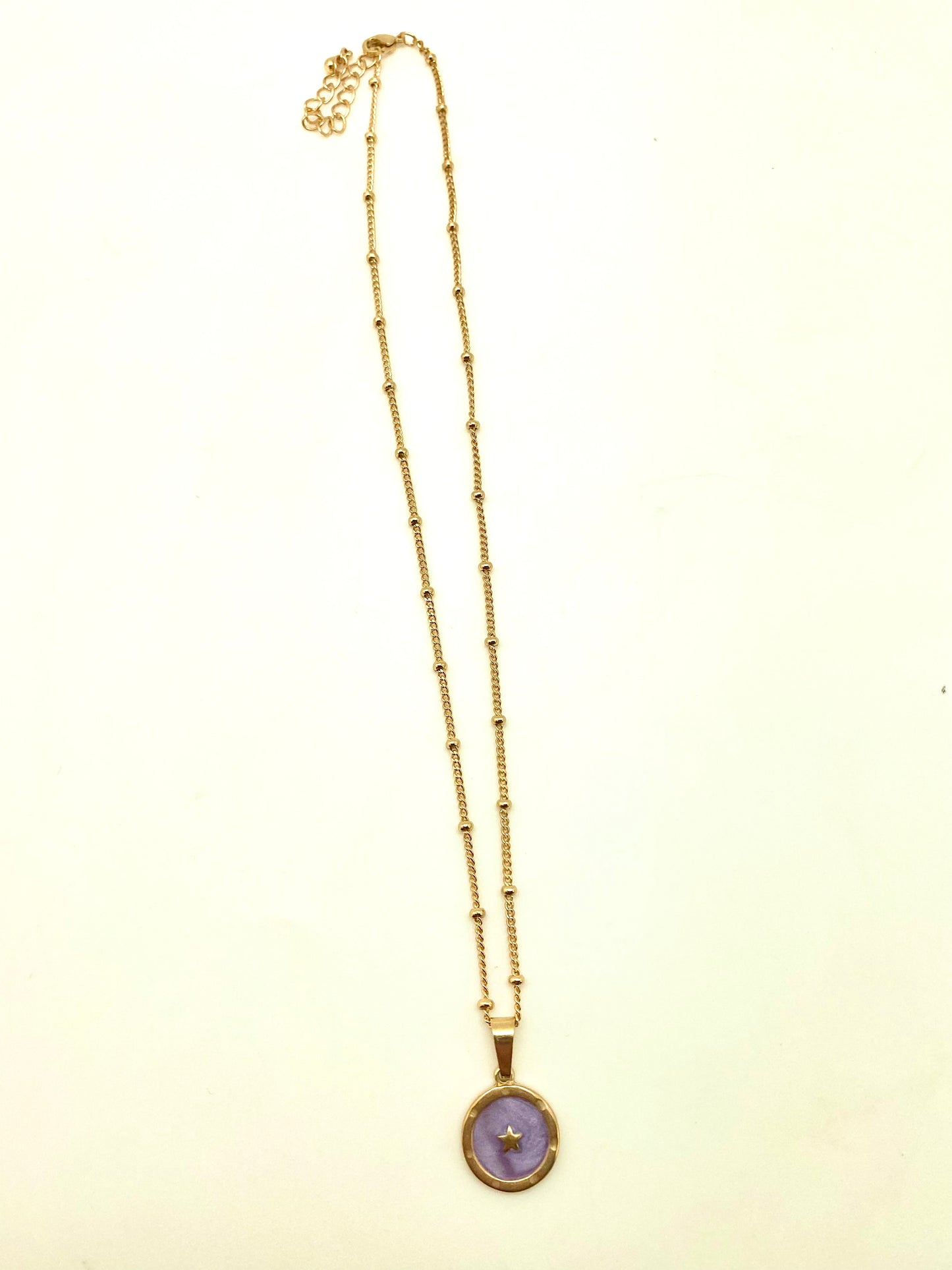 Cadena medalla estrella morada