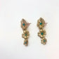 Pendientes realizados con aguamarinas montadas en flores de latón con baño de oro. Materiales de primera calidad. Terminado a mano. Medidas largo 3,5cm